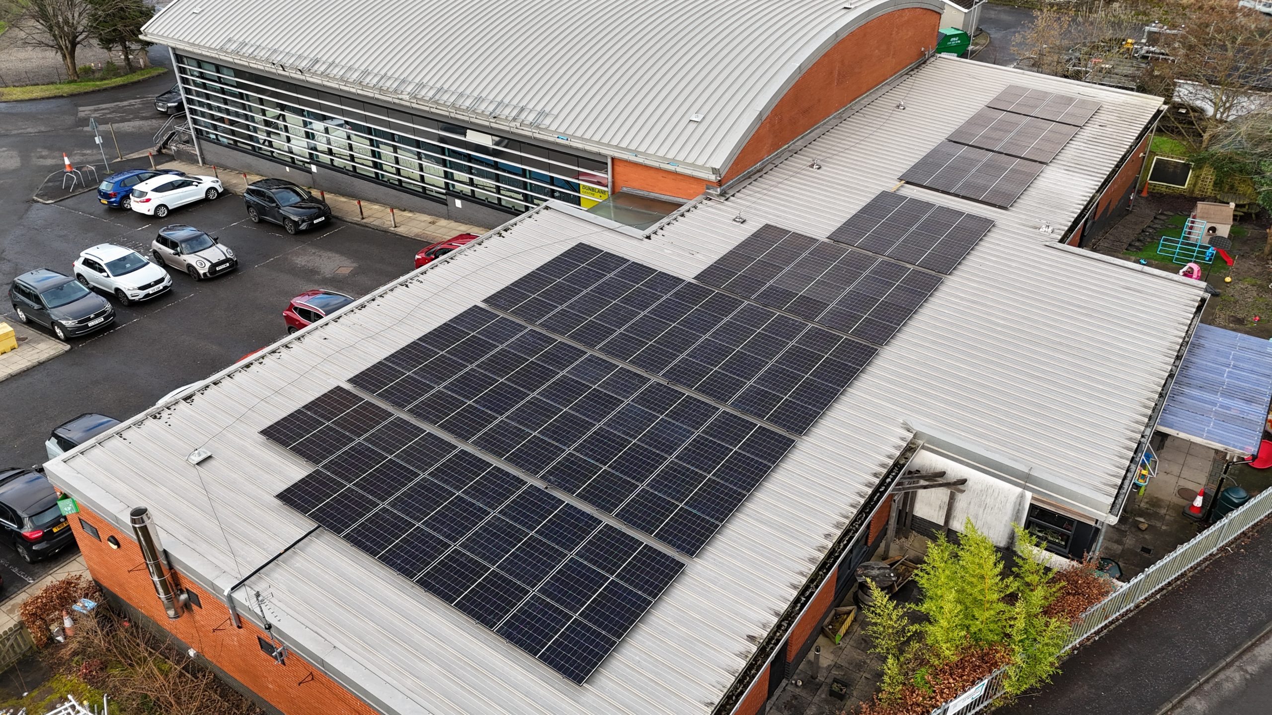 Aerial view of the 96-panel, 50kW rooftop solar array installed at the Dunblane Centre, Dunblane, by Lynx Sustainable Solutions